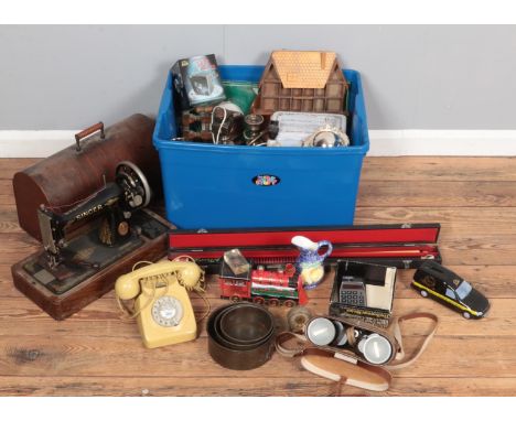 A box of miscellaneous. Includes cased Singer sewing machine, Yashica Binoculars, rotary telephone, Regency Fine Art figure, 