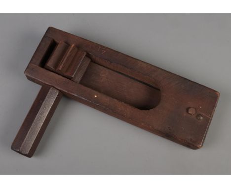 A World War Two wooden gas rattle, stamped RCD 1944 and bearing broad arrow mark.  