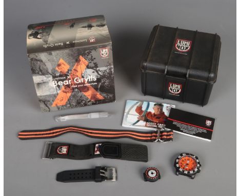 A Luminox X Scott Cassell men's automatic wristwatch with hardcase. Features assorted straps and compass.  Watch head is miss