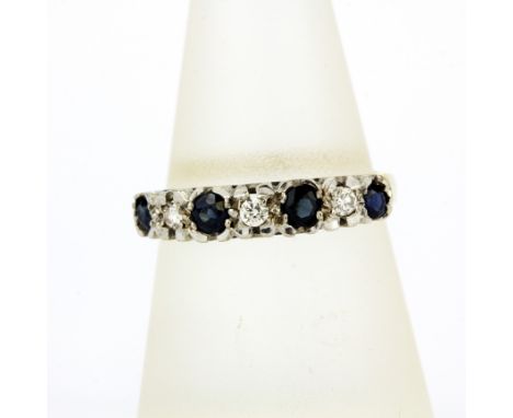 A hallmarked 18ct yellow gold diamond and sapphire set half eternity ring, (Q.5), gross weight approx. 3.4gr.&nbsp;