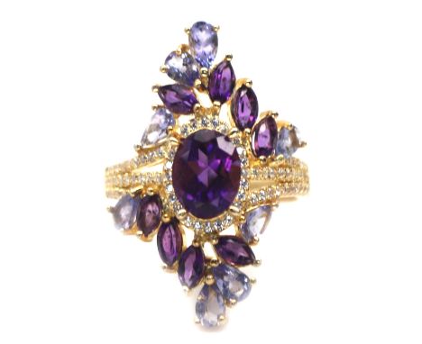 A gold on 925 silver ring set with amethysts and tanzanites, L. 3cm, ring size O.