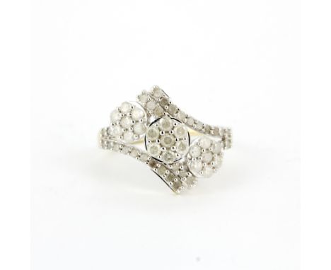 A 10ct yellow and white gold (marked 10K) diamond set ring, (O).