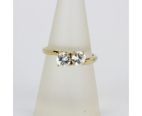 A 10ct yellow gold (marked 10K) ring set with round cut white topaz, (N.5).