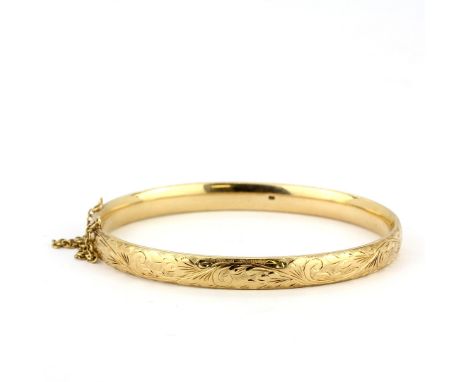 A heavy 9ct yellow gold bangle, internal L. 6.5cm, approx. 35.7gr.&nbsp;