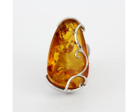 A large 925 silver and amber set ring, (P).