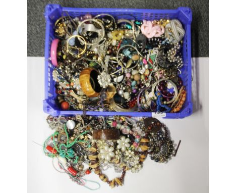 A large box of costume jewellery.