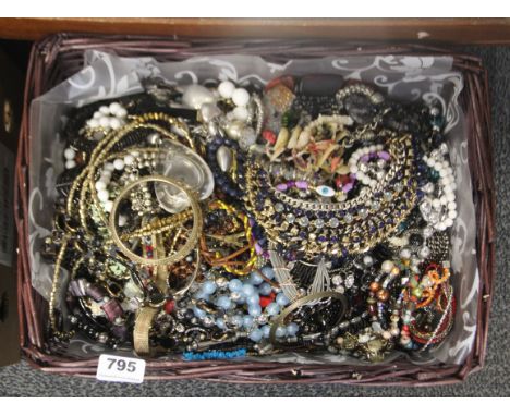 A large box of costume jewellery.