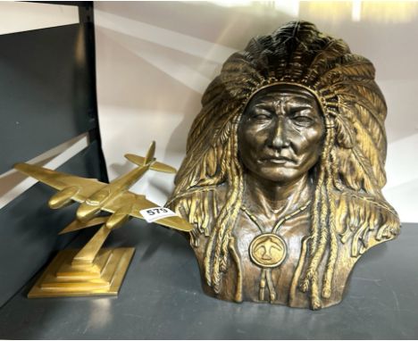 A brass model of an aircraft, together with a painted ceramic figure of a Native American Chief, H. 39cm.