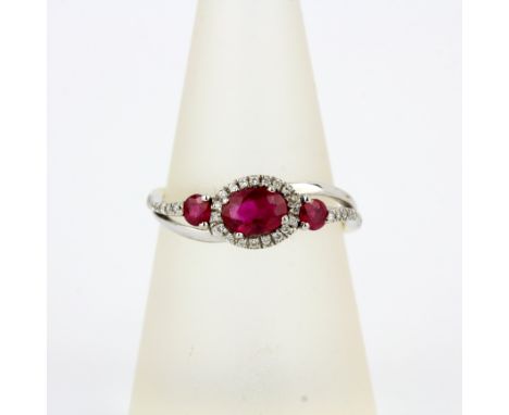 An 18ct gold and platinum ruby and diamond set ring, (O.5).