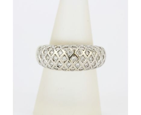 A heavy yellow and white metal (tested minimum 9ct gold) diamond set pave ring, (Q), gross weight approx. 11.8gr.&nbsp;