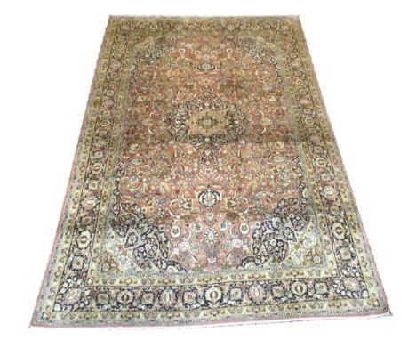 VERY FINE PURE SILK CARPET, 282cm x 185cm, central medallion on a field of palmettes and scrolling vines within in correspond