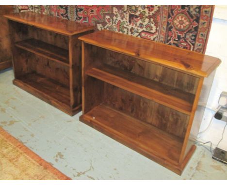 LOW OPEN BOOKCASES, a pair, yewwood enclosing a shelf on a plinth base, 91cm W x 72.5cm H x 27cm D. (2)