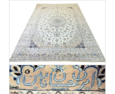 FINE SIGNED PART SILK HABIBIAN NAIN CARPET, 325cm x 206cm, central medallion on an ivory field of scrolling palmette and vine