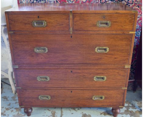 ARMY AND NAVY CAMPAIGN CHEST, 19th century teak and brass bound with two short and three long drawers with turned supports an