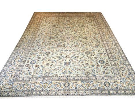 FINE KASHAN CARPET, 410cm x 308cm, central medallion on a jade field within corresponding bands and borders.