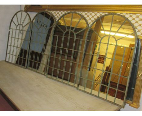GARDEN MIRRORS, a set of four, Architectural style verdigris metal with an arched top, 49cm W x 77cm H. (4)
