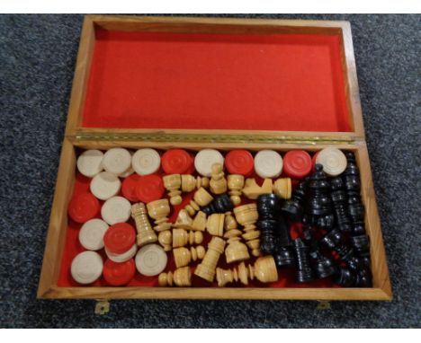A wooden chess board and pieces 