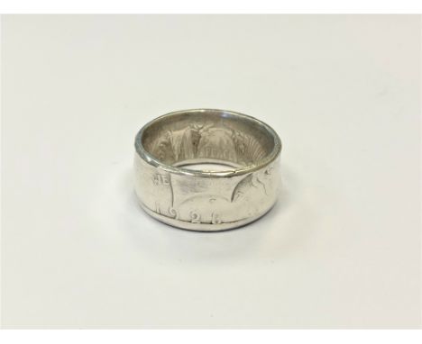 A 1923 American silver dollar ring, size W/X