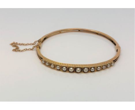 An antique gold and pearl hinged bangle CONDITION REPORT: 8.4g