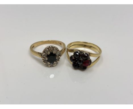 An 18ct gold sapphire and diamond ring and a gold garnet ring (2)