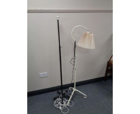 An early twentieth century painted cast iron extending floor lamp and one other 