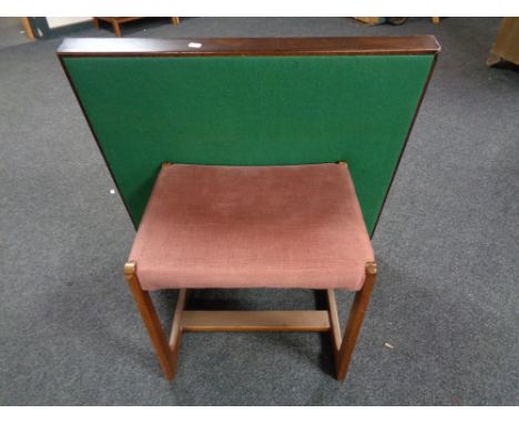 A mid century teak dressing table stool upholstered in pink dralon and folding card table 