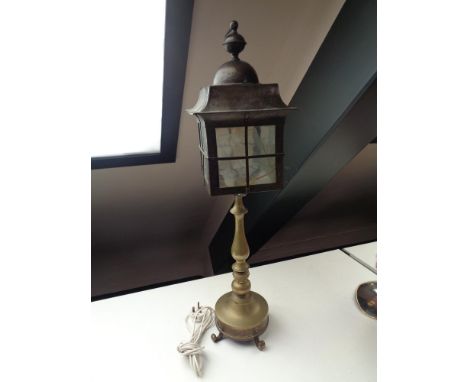A heavy brass lamp in the form of a street light 