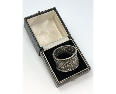 An ornate Victorian silver napkin ring, William Hutton &amp; Sons, London 1890