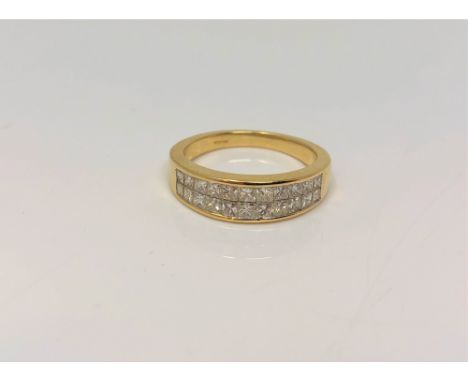 An 18ct gold ring set with 22 princess cut diamonds, total diamond weight approximately 1.7 carat, size L