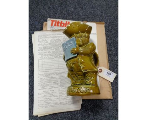 A rare glazed ware "Tit-Bits" advertising Toby jug modelled as a gentleman reading the magazine of that name, circa 1917, gla