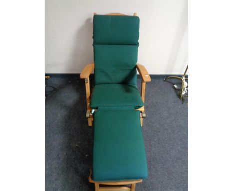 A teak steamer garden chair with adjustable foot rest and cushion 