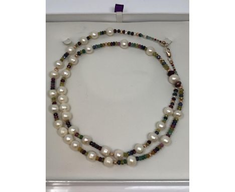A cultured pearl necklace with 9ct rose gold clasp, strung with emerald, ruby and sapphire beads