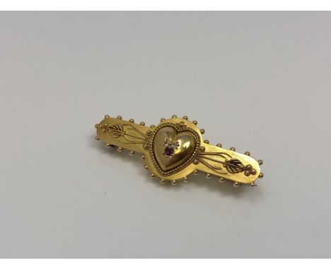A 15ct gold brooch with central heart set with ruby and diamond CONDITION REPORT: 4.0g