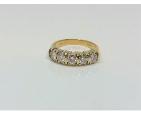 A fine 18ct gold five stone diamond half eternity ring, approximately 1.25 carat total weight, size L CONDITION REPORT: 5.2g