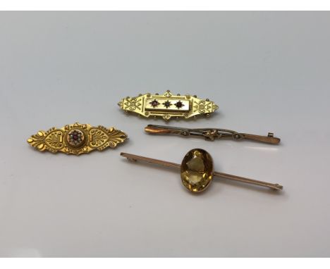 Four 9ct gold brooches, one set with ruby and diamond CONDITION REPORT: 11.9g