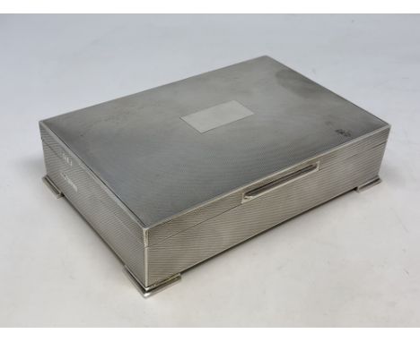 A good quality silver cigarette box with engine turned decoration, Birmingham marks 