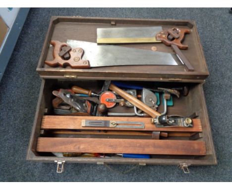 A joiner's tool box of tools, stanley planes, hand saws, brace etc 