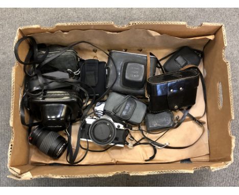 A quantity of cameras and lenses including Canon AE-1, Minolta etc 