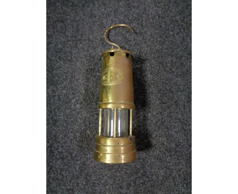 A brass lamp and Limelight miner's lamp 