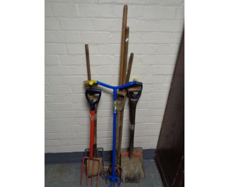 Three bundles of garden tools 