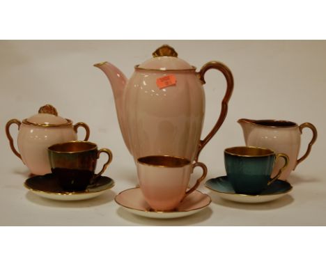 An early 20th century Carlton ware six place setting tea service on a pink ground with gilt interior, printed mark verso, imp