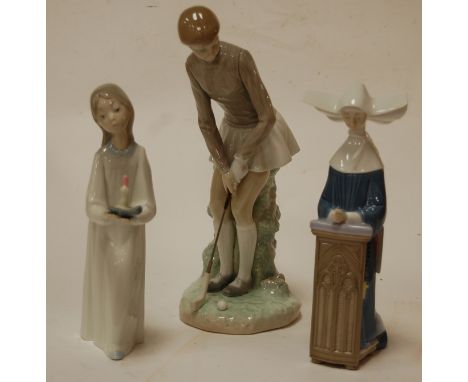 A large Lladro figure of a female golfer, printed mark verso and impressed 118, h.27cm; together with a Lladro figure of a nu
