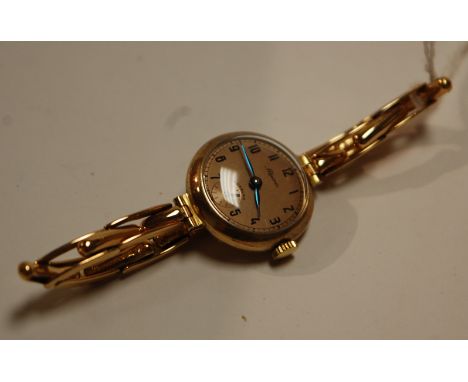 An Alpina ladies 9ct gold cased wrist watch with expanding bracelet and manual wind movement, gross weight 18.1g