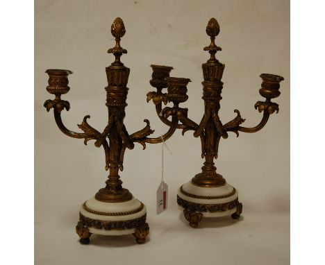 A pair of late 19th century French gilt metal twin sconce candelabra each on an onyx base