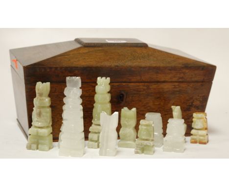 A Regency rosewood tea caddy of sarcophagus form and contents to include onyx chess pieces
