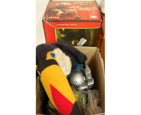 A boxed new bright battery operated Robotron RT2 walking robot together with a soft toy in the form of a toucan, plastic tank