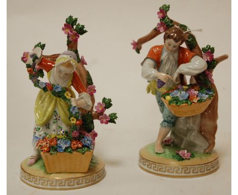 A pair of early 20th century Dresden porcelain figures of flower-pickers, printed mark verso, impressed G108891, h.19cm