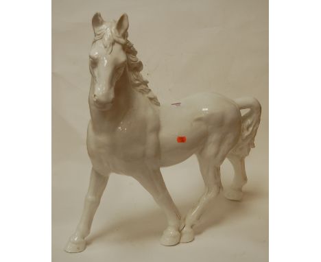 A large white glazed ceramic model of a horse, height 59cm