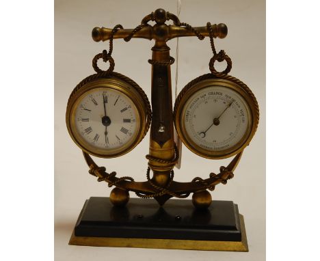 A French style gilt metal clock/barometer, having enamelled dials suspended from the arms of an anchor, the clock having repl