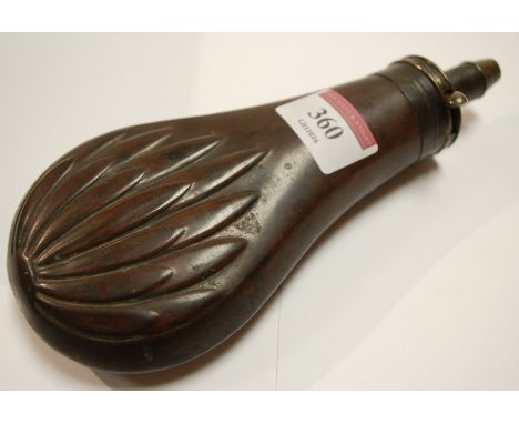 A 19th century copper powder flask, of typical form